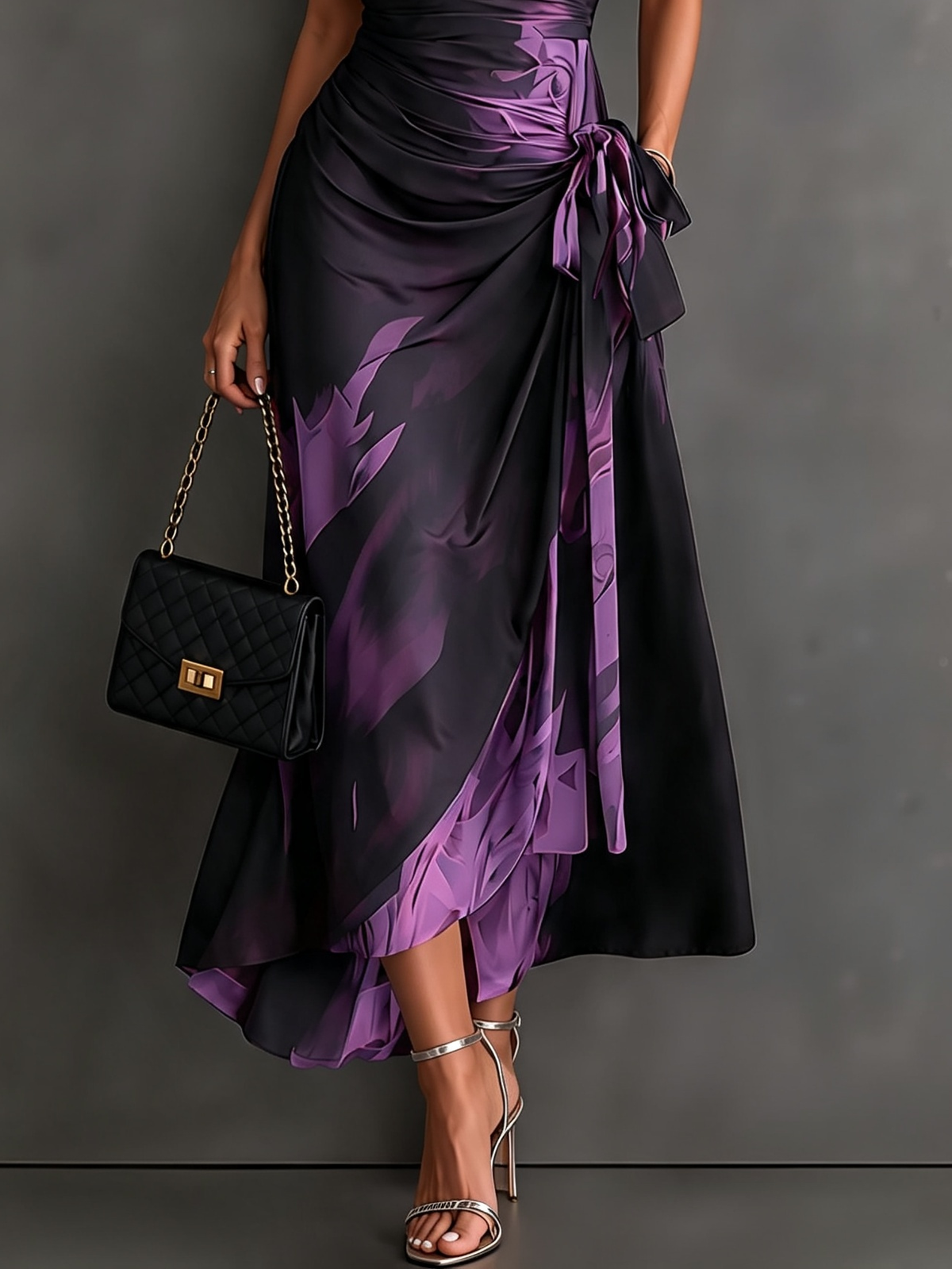 VESTIDO  CRUZADO CON ESTAMPADO ABSTRACTO ROJO Y NEGRO, CUELLO CAMISERO CON ESCOTE EN V, MANGA CORTA, CINTURA ANUDADA Y BAJO ASIMÉTRICO CON VOLANTE