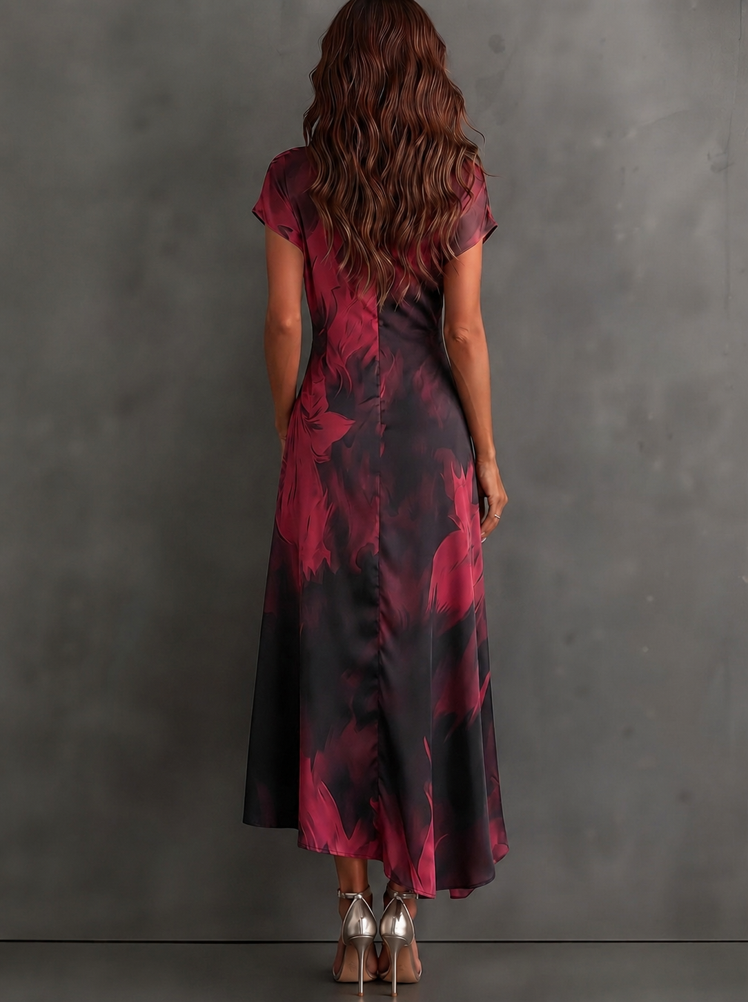 VESTIDO  CRUZADO CON ESTAMPADO ABSTRACTO ROJO Y NEGRO, CUELLO CAMISERO CON ESCOTE EN V, MANGA CORTA, CINTURA ANUDADA Y BAJO ASIMÉTRICO CON VOLANTE